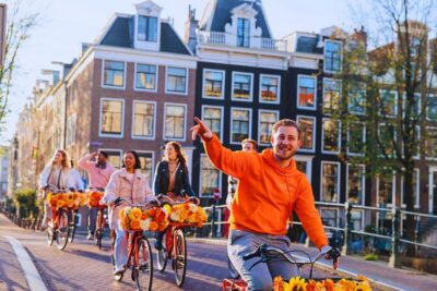 Amsterdam City Top Highlights Guided Bike Tour - Meeting at Nieuwezijds Voorburgwal: get fitted and get rolling