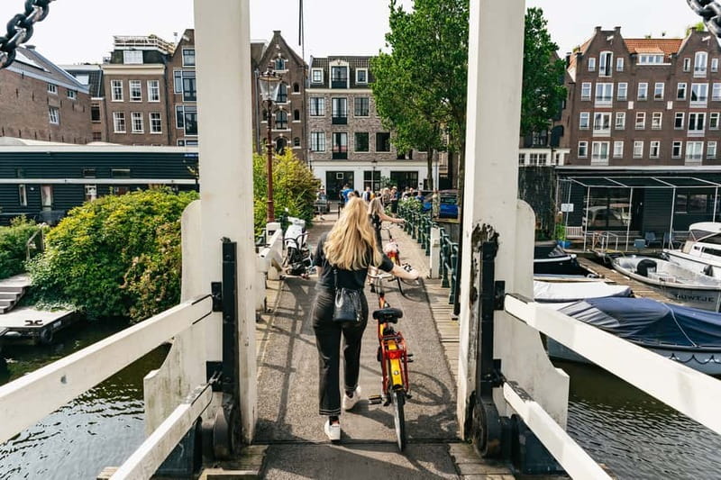 Amsterdam: Guided Bike Tour City Centre in EN/DE/FR/ES - Key highlights worth your time