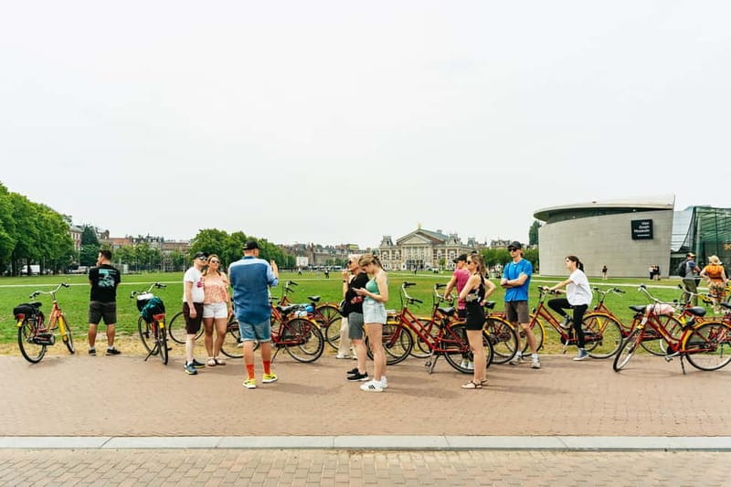 Amsterdam: Guided Bike Tour City Centre in EN/DE/FR/ES - Western Islands and Canals: Drawbridges, Warehouses, and Artist Studios
