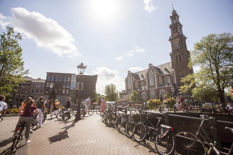 Amsterdam: Hidden Gems & Highlights Guided Bike Tour - Jordaan: canal crossings, backstreets, and tucked-away courtyards