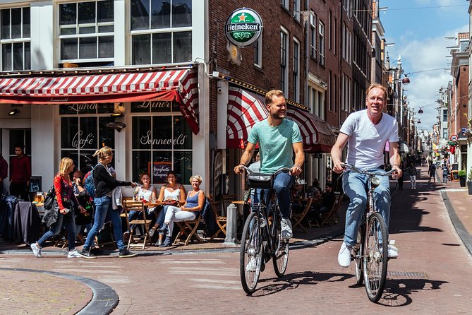 Amsterdam PRIVATE Bike Tour With Locals: Bike & Local Snack Included - Jordaan Canal Lanes and Market Streets: What the Ride Feels Like