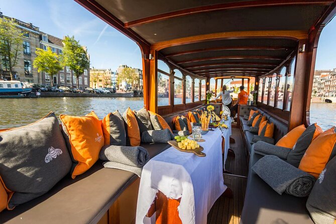 Amsterdam Small-Group Bike Tour With Canal Cruise, Drinks, Cheese - Prins Hendrik Bust and the Shift to the Canals