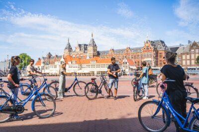 Amsterdam Small-Group Bike Tour With Optional Canal Cruise - Price and value: $30.25 for a guide, a bike, and real sightings