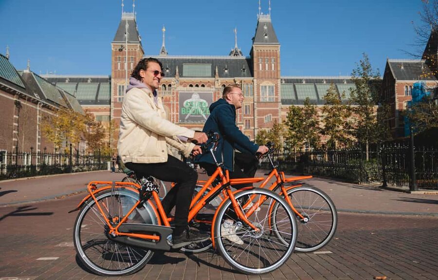 Amsterdam: Top Highlights Guided Bike Tour EN/DE/ES/FR/IT/CN - Audio App Option: If You Like to Match the Details
