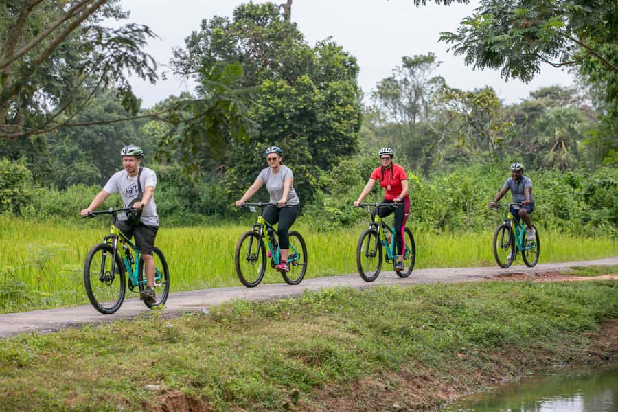 Angkor Wat: Guided Sunrise Bike Tour w/ Breakfast and Lunch - Bikes, helmets, and the e-bike option for an easier ride