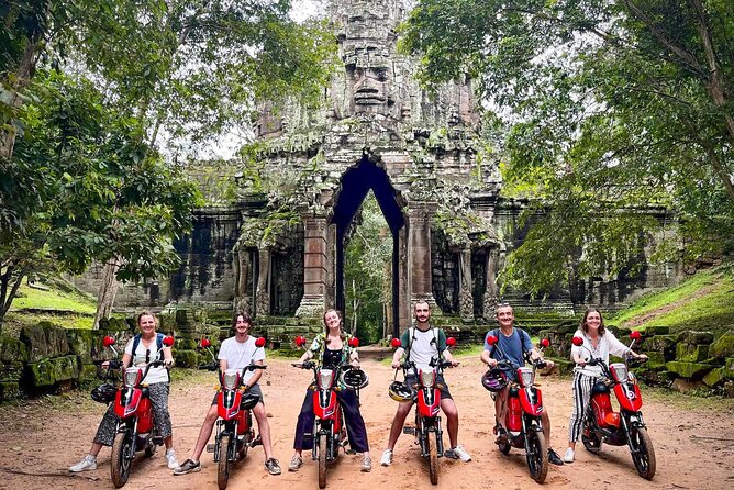 Angkor Wat Sunrise Tour By E-Bike Experience With Breakfast Included - Angkor Thom’s victory gate: the ride-through moment