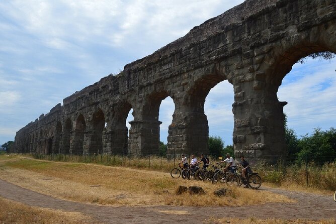 Appian Way Bike tour Underground with Catacombs & Lunch - Descending 40 Feet: Underground Tunnels and WWII Air-Raid Shelter Reality