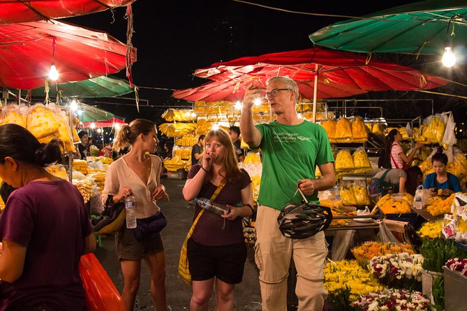 Bangkok: Night Bike Tour with Temples & Flower Market Visit - Loha Prasat and the metal-castle glow off the main roads