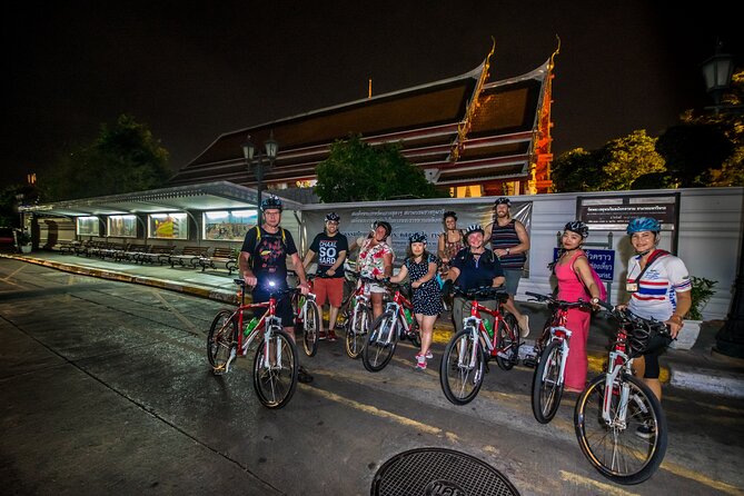 Bangkok: Night Bike Tour with Temples & Flower Market Visit - Chao Phraya ferry crossing: watching the city shimmer from the water
