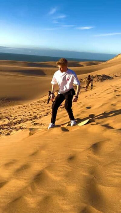 Best Agadir Desert Adventure: Quad Camel Sandboarding & BBQ - Timlalin Dunes sandboarding: ocean-to-desert energy