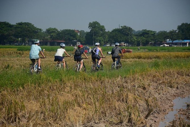 Bicycle Tours Hanoi: Full Day Bicycle Tours City & Countryside - Hanoi icons from the saddle: Flag Tower, Opera House, and the Thang Long area