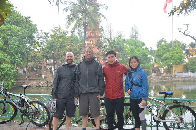 Bicycle Tours Hanoi: Half Day Hanoi City Bicycle Tours - Duờng Tau Reunification train track: locals, space, and centimeters