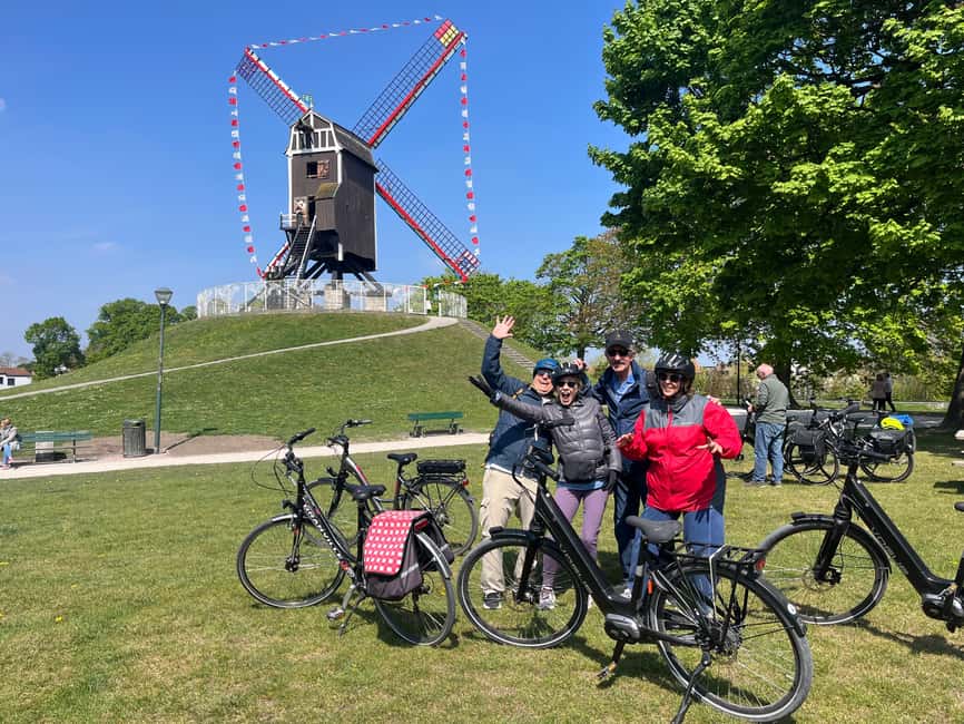 Bruges: Guided Bike Tour with a Local to Sights & Secrets - Canals, windmills, and Church of Our Lady: postcard Bruges with working context