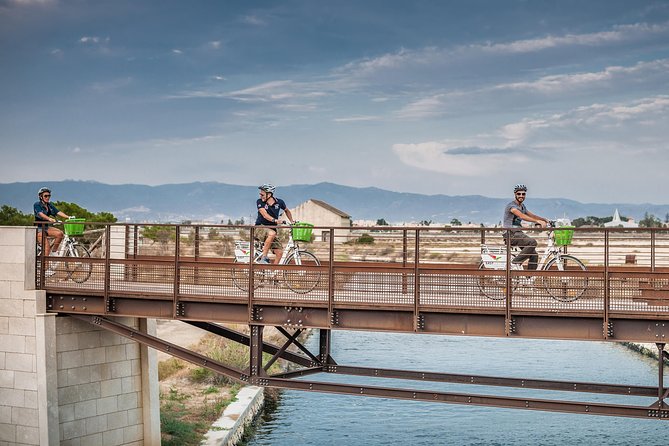 Cagliari E-Bike Tour: Gulf, Canals & Flamingos at Molentargius - Meeting at the bike shop and rolling from the harbor