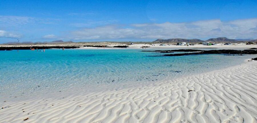 Caleta de Fuste/Corralejo: Guided E-Bike Tour & Crater Hike - El Cotillo lagoon break: swimming, surfers, and a real reset