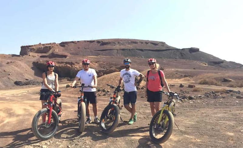 From Corralejo: Fuerteventura Guided E-Bike/E-scooter Tour - Returning Along the Ocean and Pop Corn Beach stop