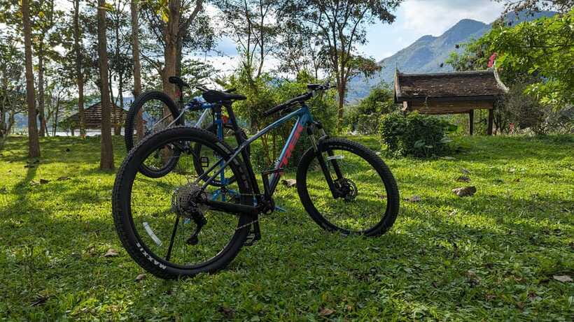 From Luang Prabang: Guided Mountain Bike Tour with Lunch - Village stops and Buddhism lessons: what the guide adds