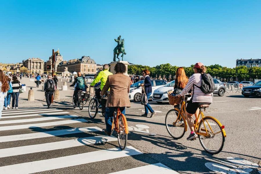 From Paris: Skip-the-Line Palace of Versailles Bike Tour - More riding through Versailles grounds for scenic payoff
