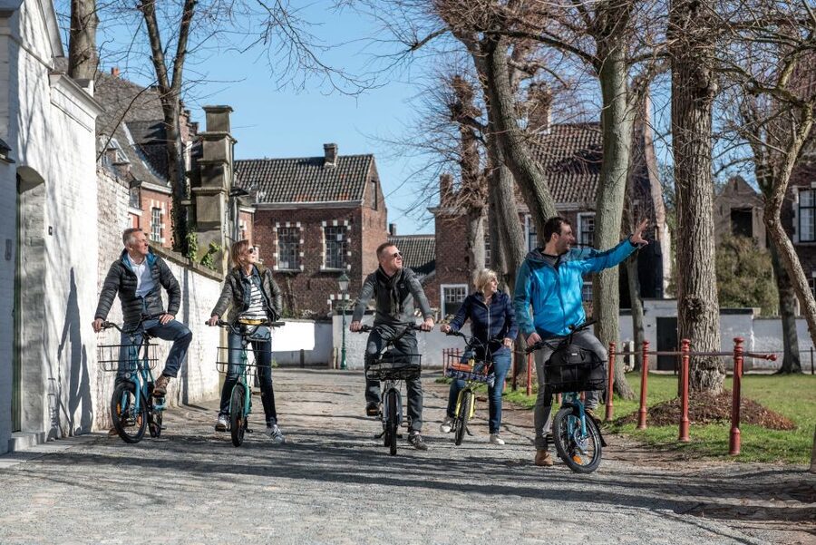 Ghent: City Highlights and Hidden Gems Guided Bike Tour - Entering Ghent from the saddle