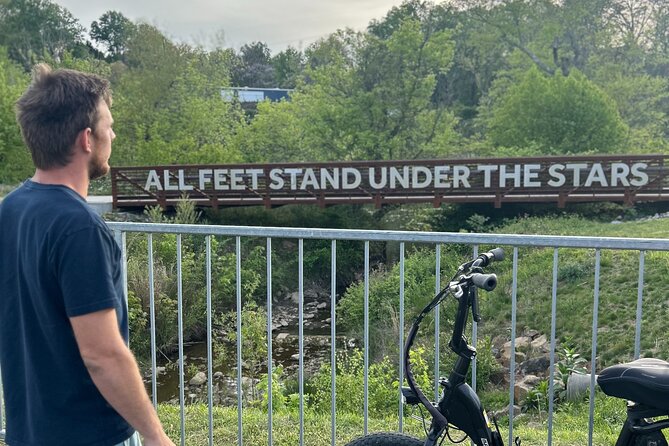 Guided Asheville E-bike Tour of River Arts, Mountains and Murals - French Broad River Park: wide paths, shade, and river views