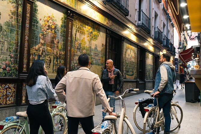 Madrid at Night: Vintage Bike Tour of City Highlights - Plaza de España and the Royal Palace at night