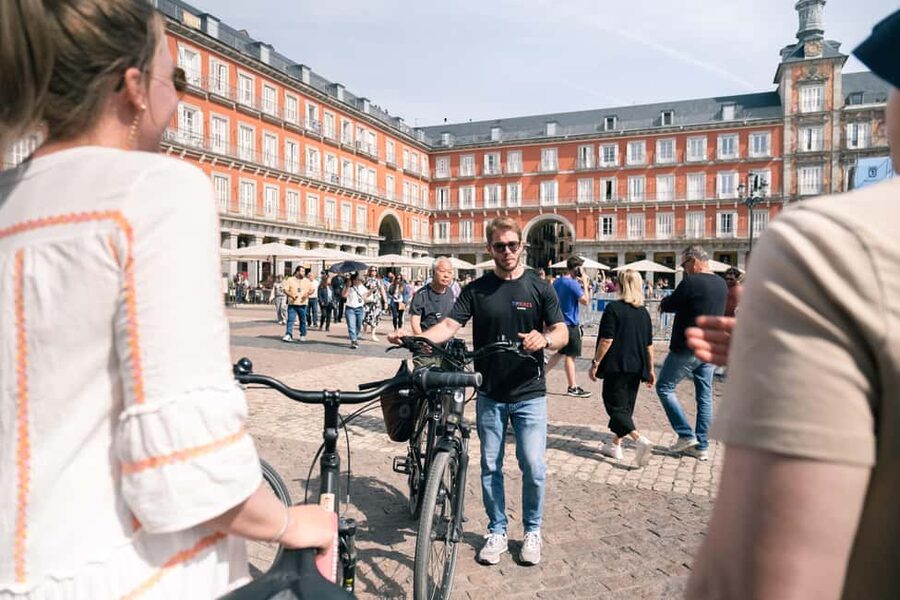 Madrid: Highlights Bike Tour with Optional E-Bike or Tapas - Plaza Mayor and Plaza de Santa Ana: two iconic squares with different moods