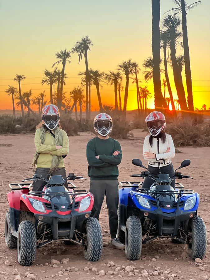 Marrakech: Palm Grove and Jbilat Desert Quad Bike Tour - Pickup, van ride, and getting kitted up fast
