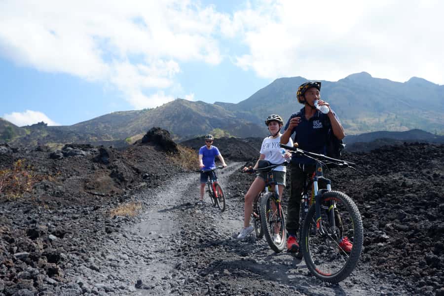 Mount Batur: Black Lava Cycling Tour w/ Natural Hot Spring - Coffee Plantation Stops and Lunch Views: When the Day Gets Leisurely
