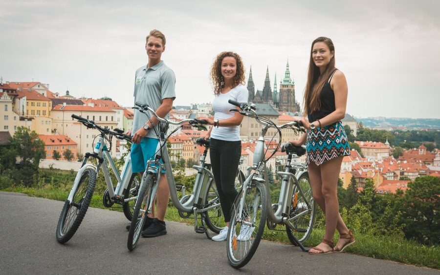 Prague: Bike or E-Bike City Tour with A Local Guide - View of the Dancing House to the National Theatre: modern lines on a historic river