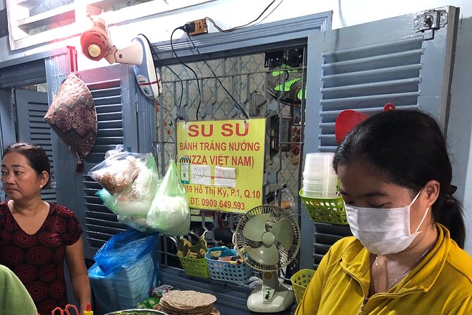 Private Half-Day Bike Tour in Saigon with Guide - Nguyen Hue Street and the Bike the Night rooftop moment