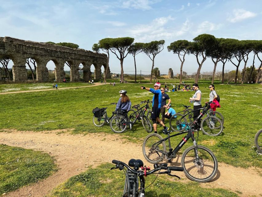 Rome: Appian Way E-Bike Tour Catacombs, Aqueducts & Picnic - Catacombs of St Callisto or St Sebastian: guided, underground, and cool by default