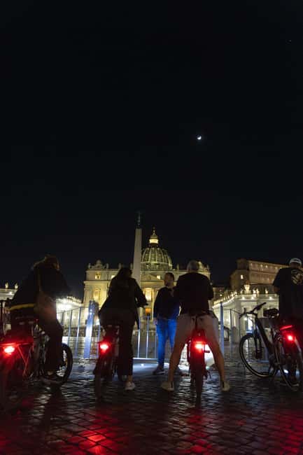 Rome by Night: E-bike Small Group Tour -Food & Wine (Option) - Crossing Toward Vatican Night Lights: Saint Peter’s Square