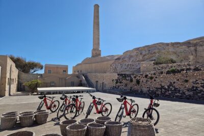 Santorini Small Group Guided E-bike Tour & Local Tomato Museum - Getting Set with Helmet, Water, and the Right Bike Feel