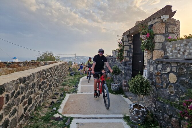 Santorini Small Group Guided E-bike Tour & Local Tomato Museum - Vineyard Stop: Basket-Pruned Grapes and the Local Logic