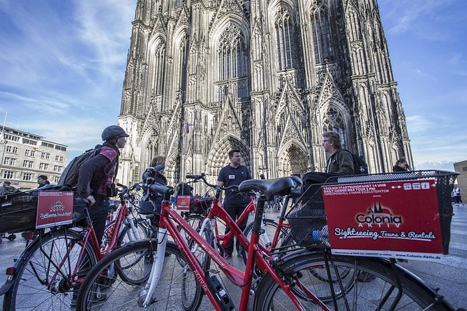 Small-Group Bike Tour of Cologne with Guide - Passing the Cologne Philharmonie, then slowing down at the cathedral area