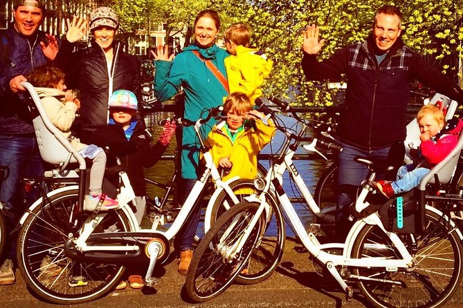 Small Group Guided Bike Tour of Amsterdam's Hidden Gems - Rijksmuseum area stop: big building, fast context