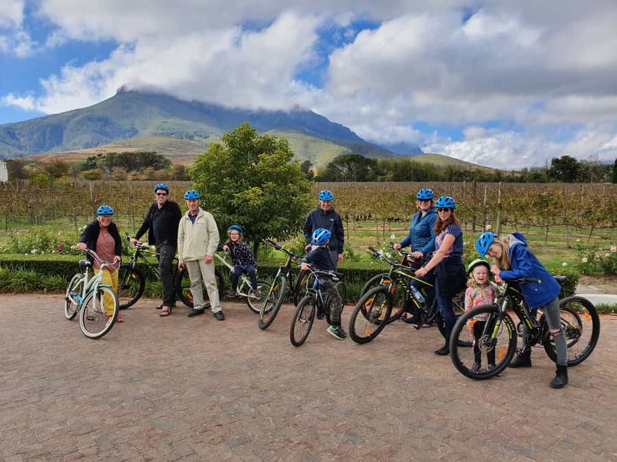 Stellenbosch: Historical Bike Tour & Wine Tasting - First wine estate stop: award-winning pours with mountain views