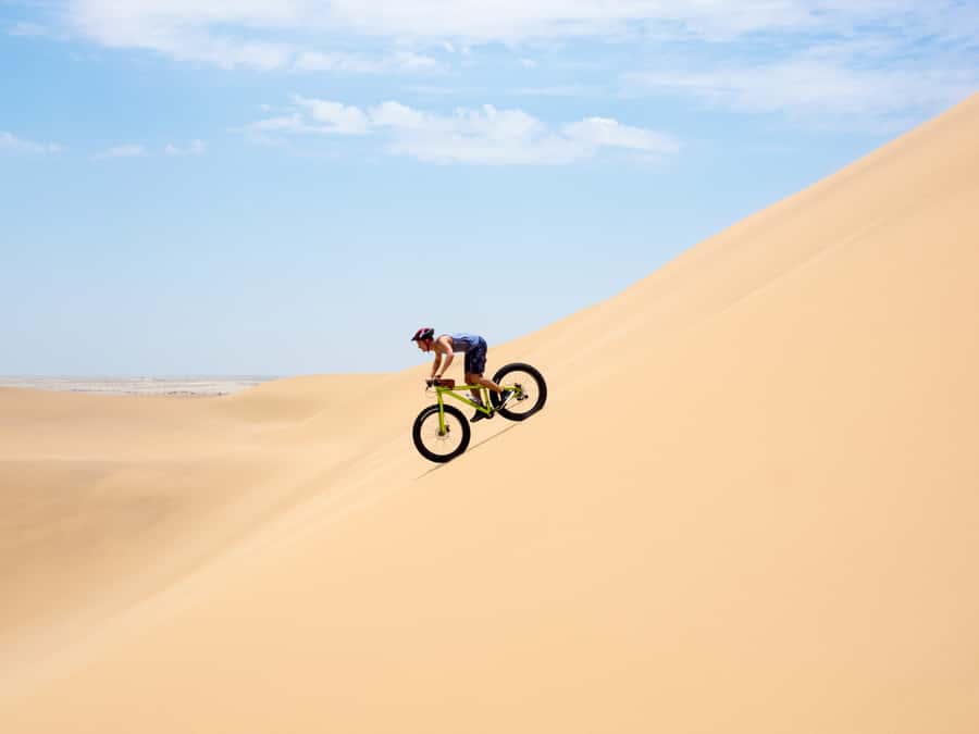 Swakopmund: Scenic Desert Bike Tour - Riding up the dunes: the climb that turns into a payoff