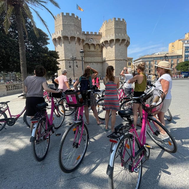 Valencia: City Highlights Guided Bike Tour - Medieval walls and riverside greens: Serranos and the Túria Gardens